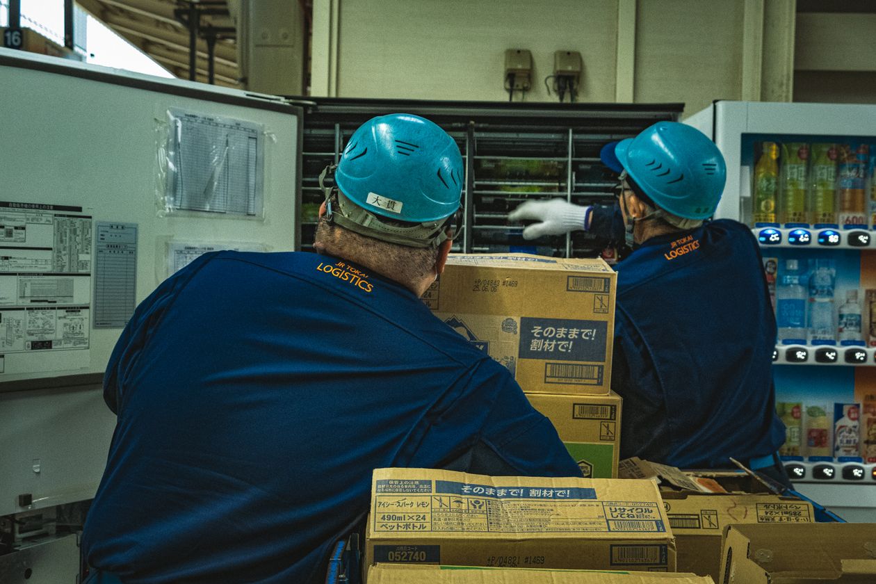 Warehouse workers lifting and carrying boxes — manual-labor back pain, Saint Paul Park MN
