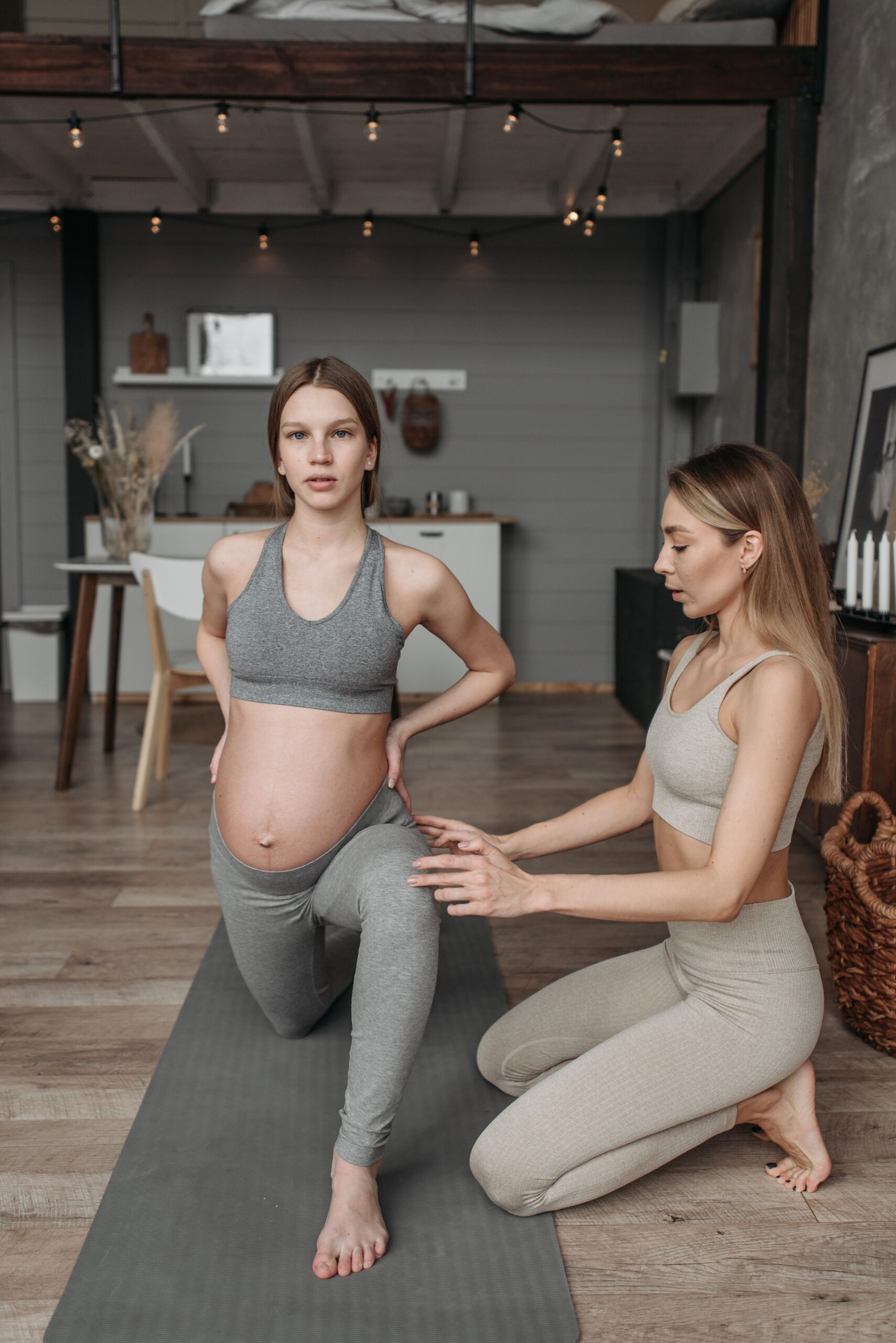 Pregnant woman doing a gentle, supported stretch — pregnancy-adapted chiropractic care, Saint Paul Park MN